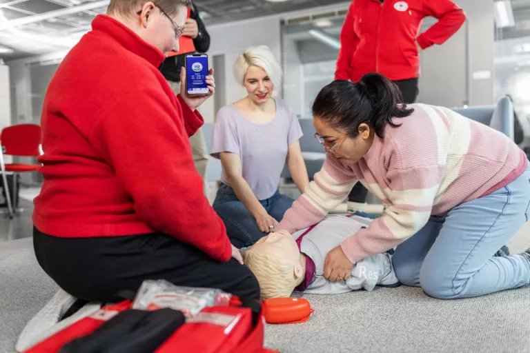 FRC first aid teams practising first aid with a dummy.